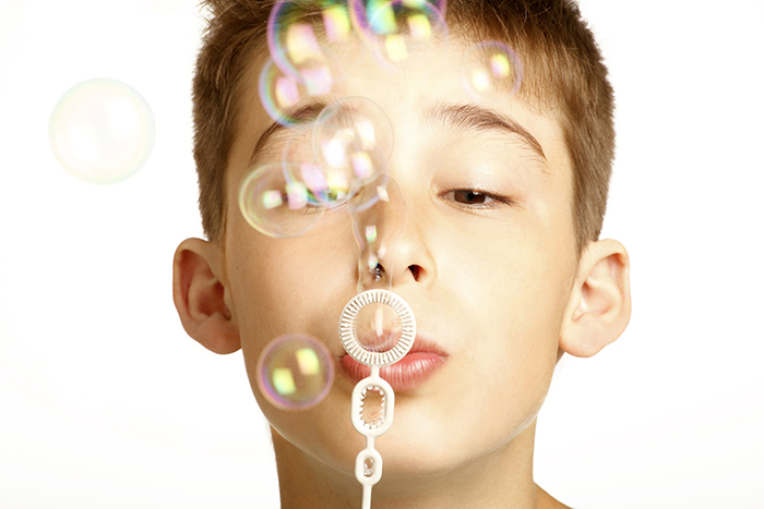 kid play with bubbles